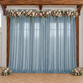 Elegant blue sheer wedding backdrop with floral garland and wood frame