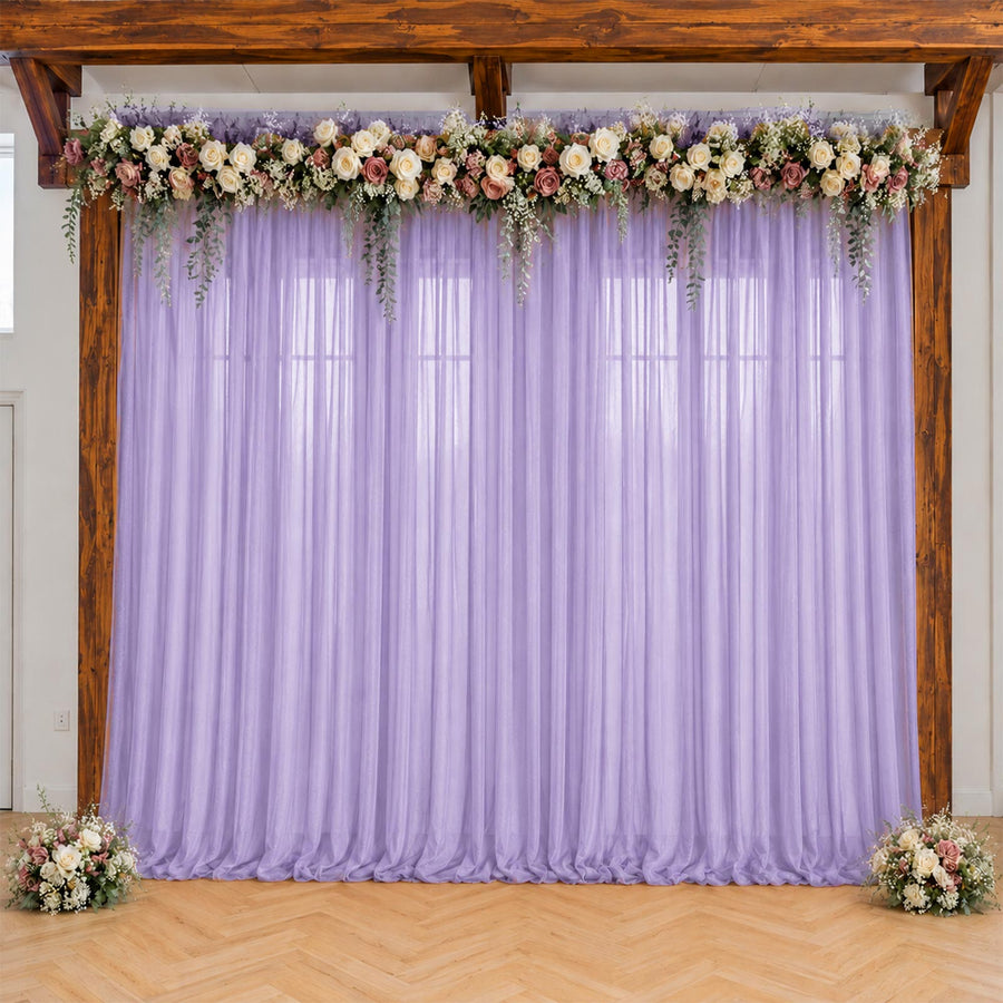 Lavender wedding backdrop with floral garland and rustic wooden arch
