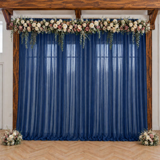 Navy blue wedding backdrop with floral garland and wooden frame