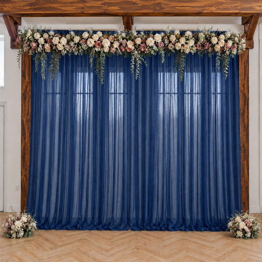 Navy blue wedding backdrop with floral garland and wooden frame