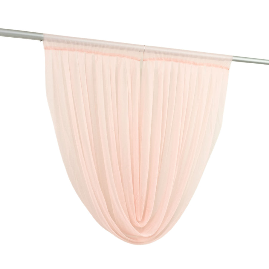 Sheer peach curtain panel hanging on rod