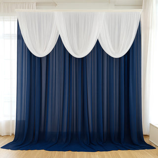 Navy blue and white draped curtain backdrop for events