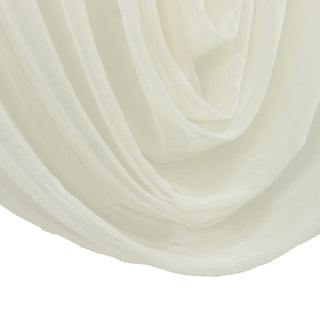 Close-up of layered white sheer curtain folds