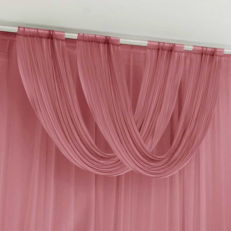 Pink sheer curtain draped elegantly on a rod.