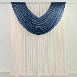 Draped fabric curtain in cream and navy blue colors on a white backdrop.