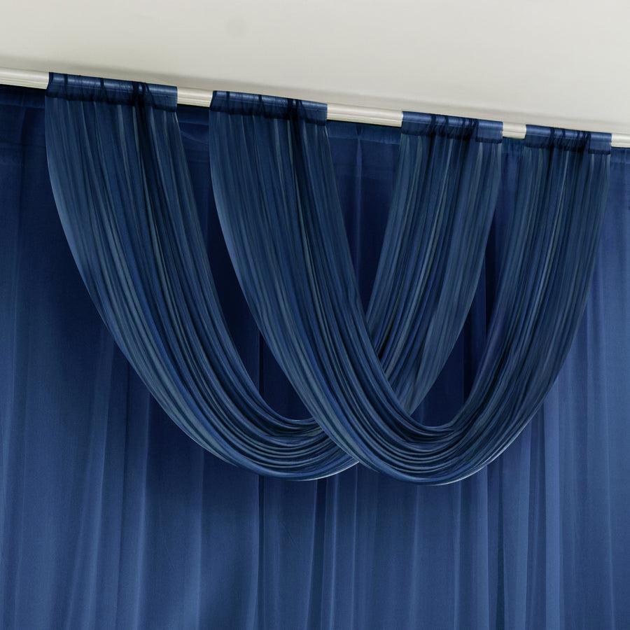 Blue sheer curtains draped on a wall