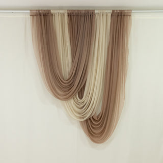 Layered sheer curtains in warm neutral tones hanging elegantly.