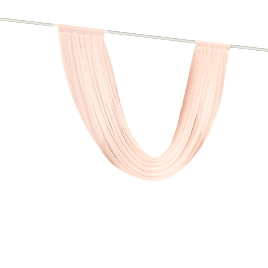 Blush sheer curtain panel draped on a white rod