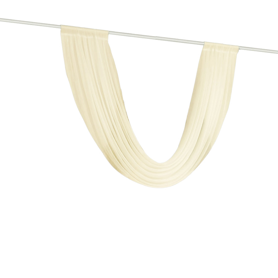 Sheer ivory curtain panel draped on rod
