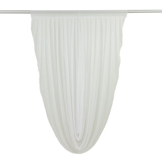 White sheer drapery panel hanging in graceful folds