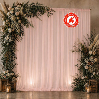 Wedding flower backdrop with blush drapery and flame retardant badge