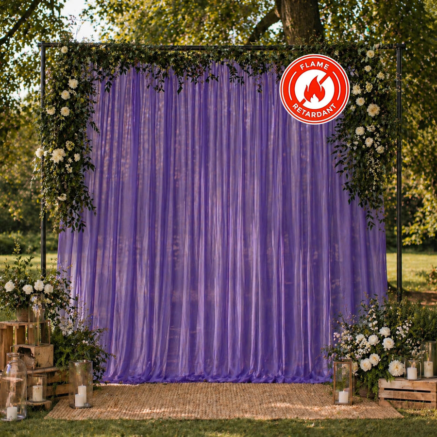 Purple wedding backdrop with floral arch and flame retardant sign