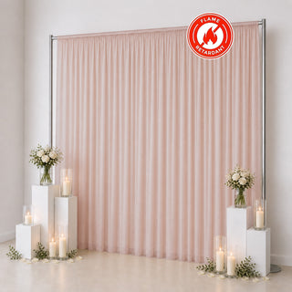 Pink sheer flame retardant curtain backdrop with candles and floral decor