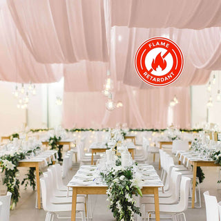 Elegant event space with flame-retardant decor and stylish table settings.