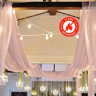 Flame-retardant drapery with lights in an elegant event space.