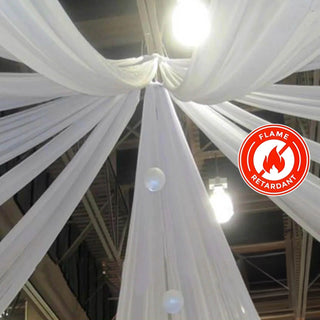Flame retardant white drapery fabric hanging from the ceiling.