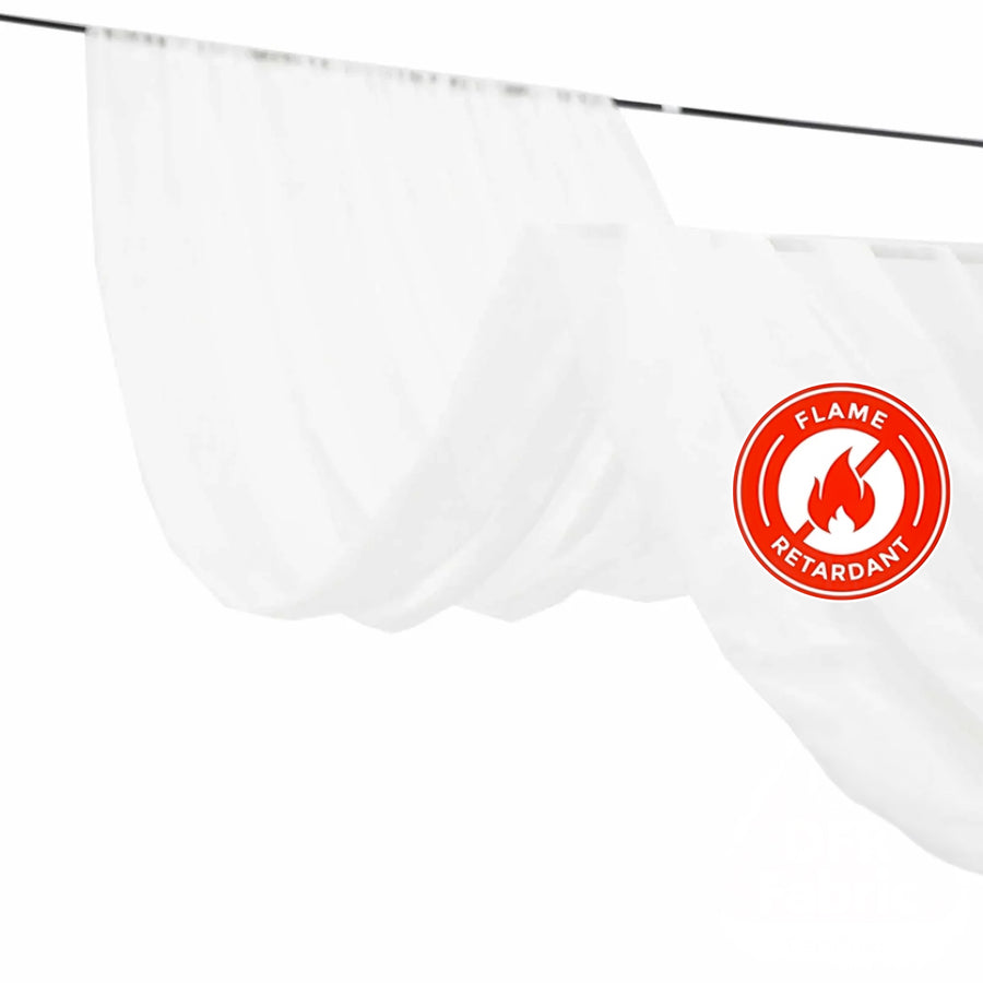 Flame retardant white curtain draped on a rod