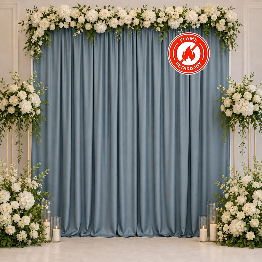 Floral wedding backdrop with blue curtains and white roses, flame retardant