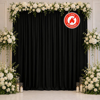 Elegant black curtain floral wedding backdrop with white roses and candles