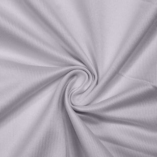 Light gray ribbed fabric texture with spiral fold pattern#whtbkgd