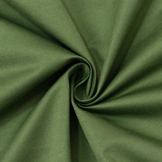 Green ribbed fabric swirl texture close-up#whtbkgd