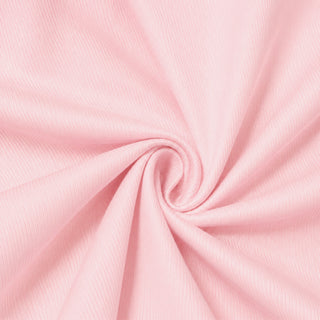 Soft pink fabric swirl texture background in close-up