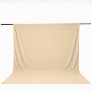 Beige seamless backdrop curtain on support rod for photography studio#whtbkgd