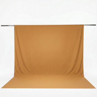 Gold seamless backdrop with floor sweep on support pole#whtbkgd