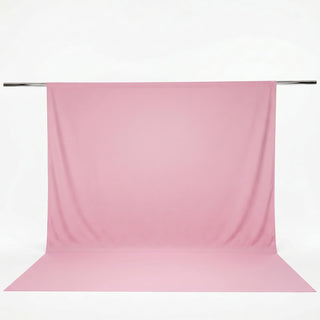 Pink seamless photography backdrop on a backdrop stand#whtbkgd