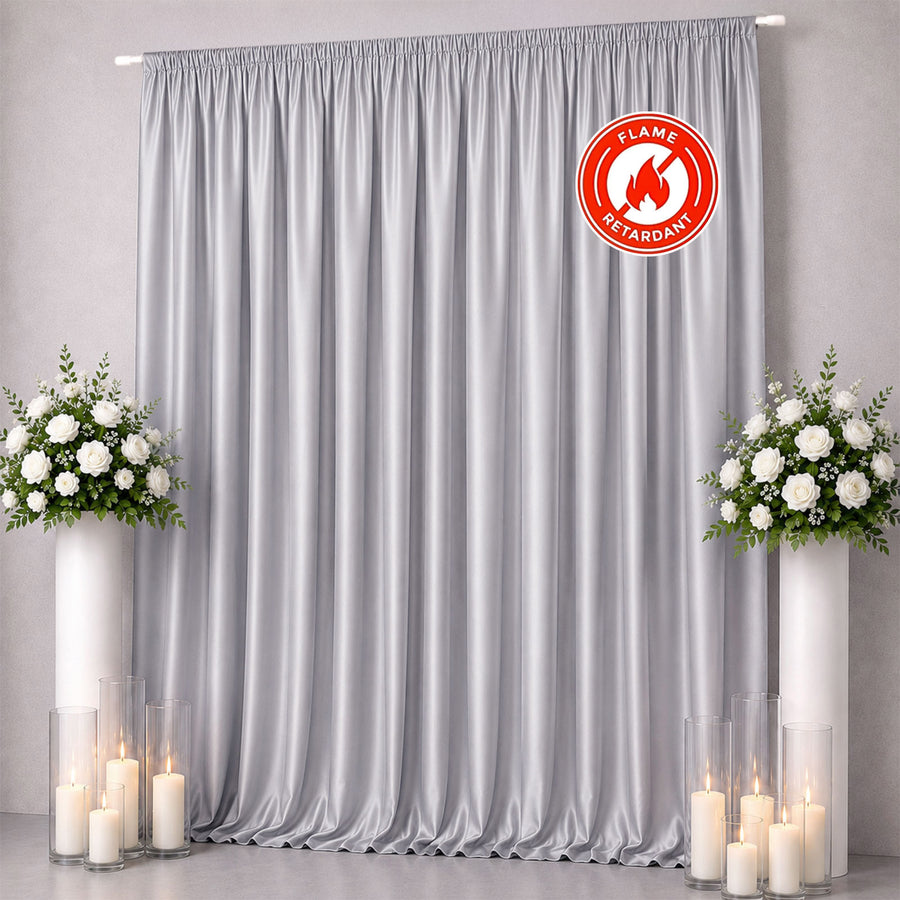 Gray flame-retardant curtain backdrop with floral arrangements and candles