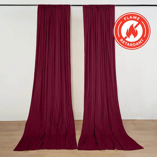 Maroon flame retardant curtains hanging on a track in a room