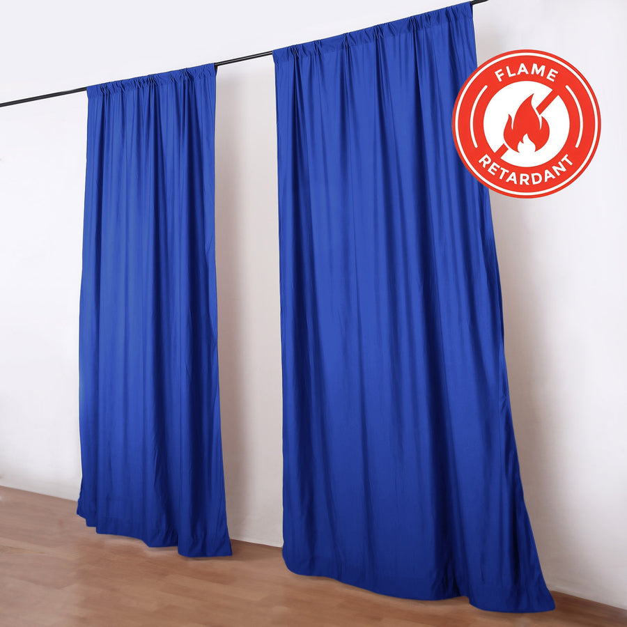 Blue flame retardant curtains on rod in room, fire-resistant drapes