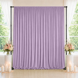 Lavender wedding backdrop with floral arrangements and candles