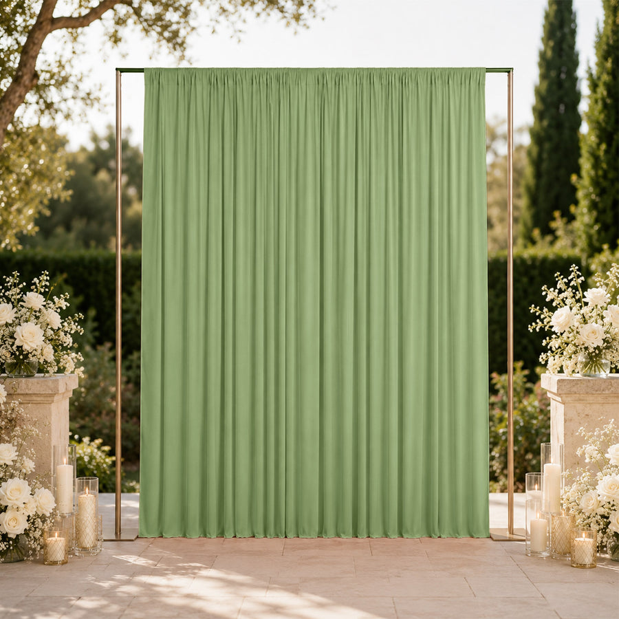 Elegant green wedding backdrop with floral arrangements and candles