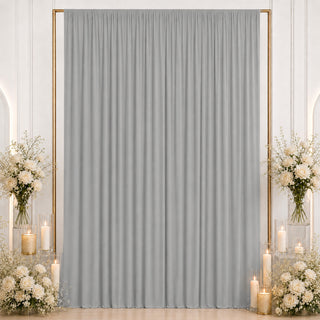 Elegant gray curtain backdrop with white roses and candles for weddings