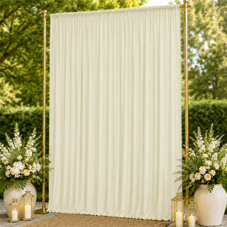 Elegant ivory wedding backdrop with gold frame, floral arrangements and lanterns