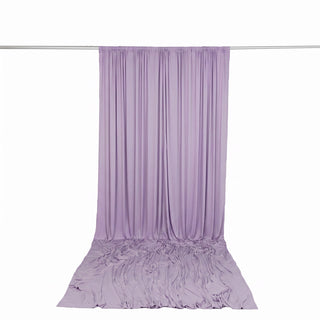 Lavender sheer curtain draped on rod with pooled fabric backdrop