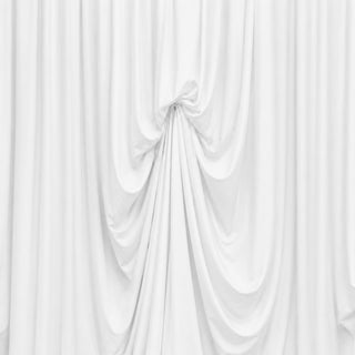 White draped fabric backdrop with soft gathered folds and elegant texture