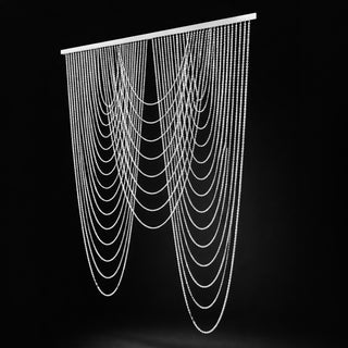 Beaded curtain with cascading strands on a black background.