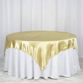 Elevate Your Event with the Champagne Seamless Satin Square Tablecloth Overlay
