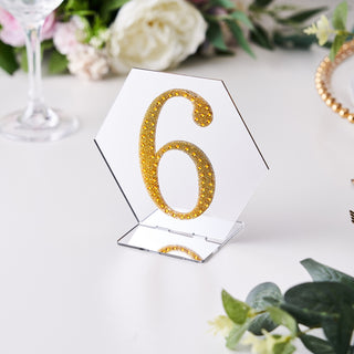 Gold glitter table number 6 on a clear acrylic base