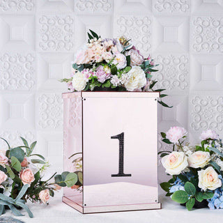 Decorative rose gold box with the number one and floral arrangement on display.
