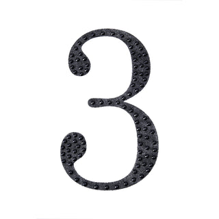 Black glitter number three on a white background.