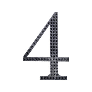 Black number four with textured dots on a plain white background