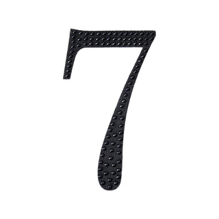 Black textured number 7 cutout on a plain background.