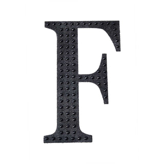 Black textured letter F on a white background