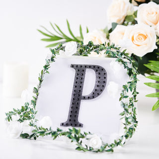 Clear bag with letter P and floral decoration on a white background.