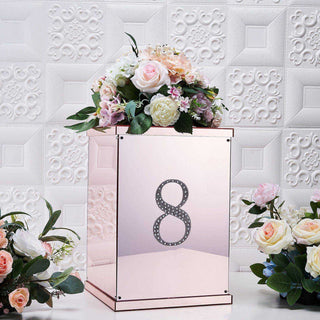 Elegant rose gold box with number 8 and floral arrangement.