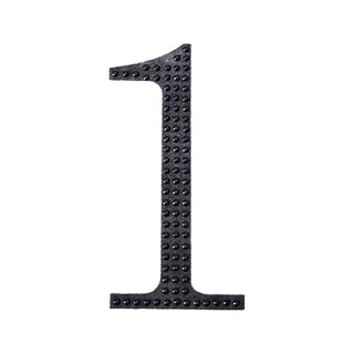 Black number one decoration with a textured surface.