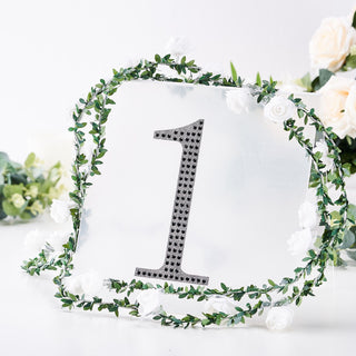 Decorative table number sign with floral accents, ideal for events and weddings.